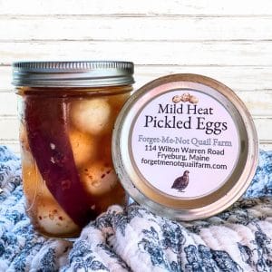 A jar of pickled eggs.