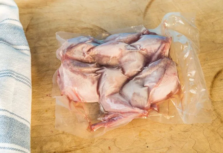 A vacuum sealed package of quail meat.